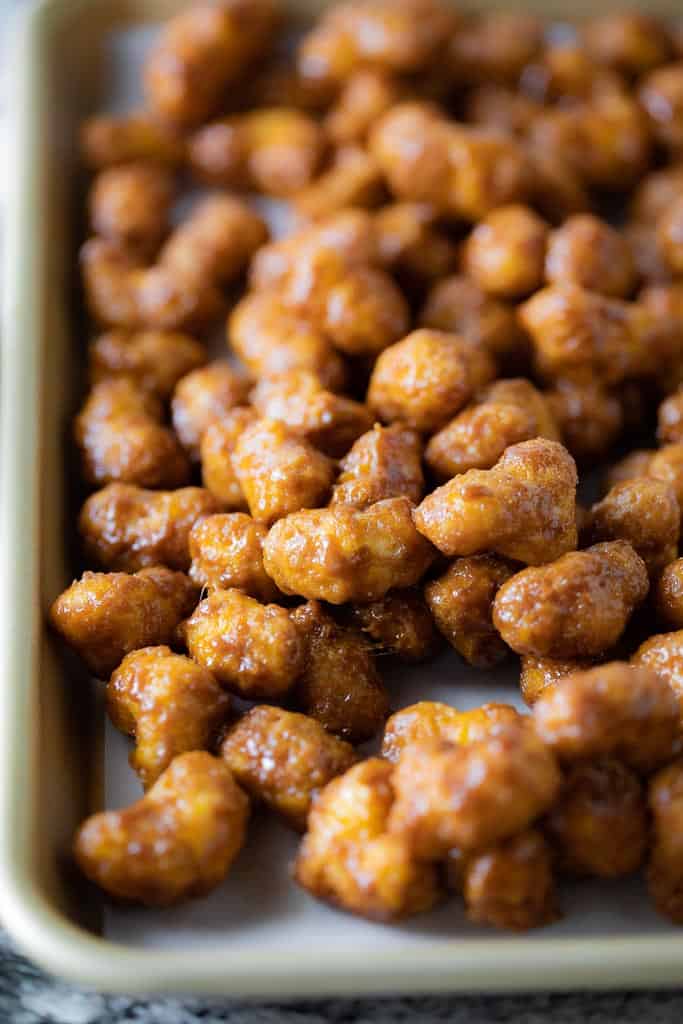 gluten free caramel puff corn on baking sheet