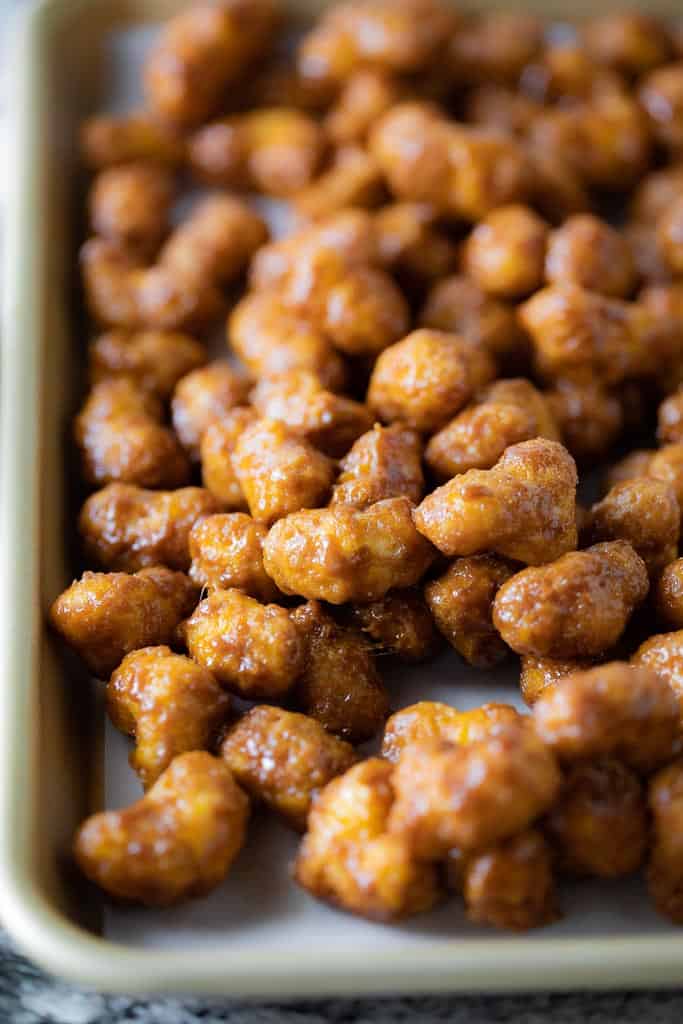 gluten free caramel puff corn on baking sheet