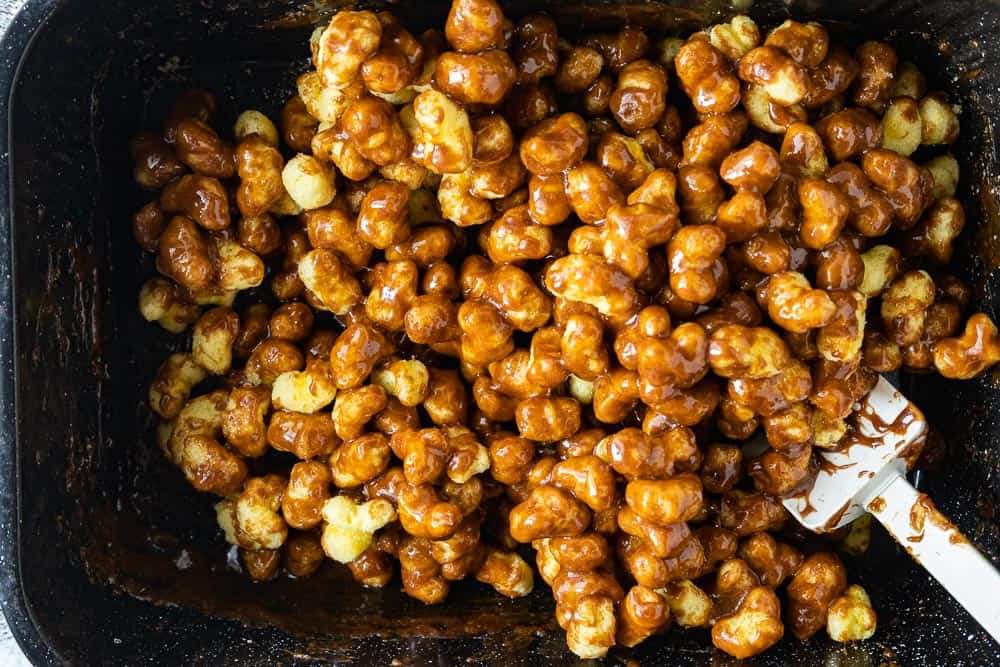 puff corn mixed with hot caramel sauce