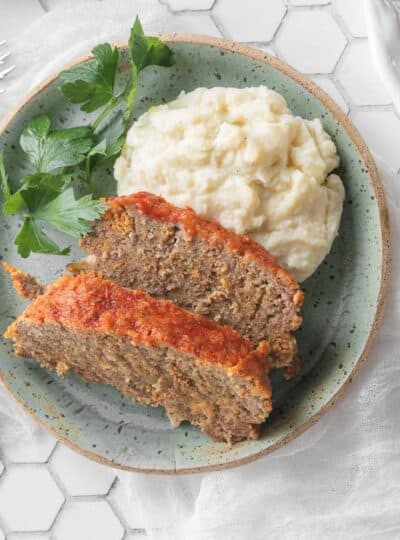 sliced gluten free meatloaf with mashed potatoes