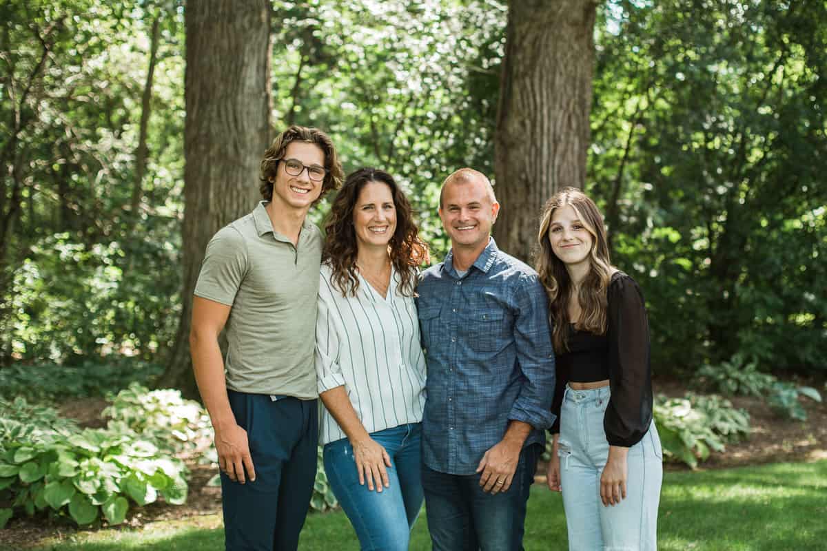 Family picture of Jodi Danen founder of Create Kids Club taken outdoors.