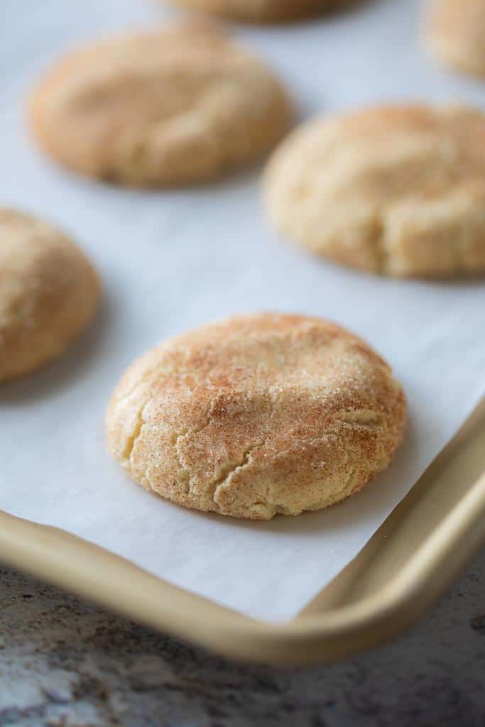 snickerdoodle cookies on a baking sheet