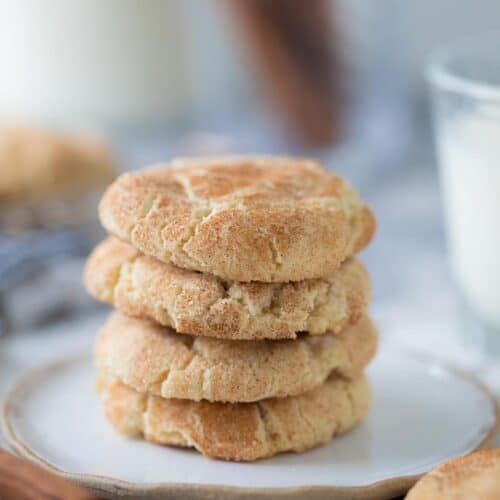 four gluten free snickerdoodle cookies stacked