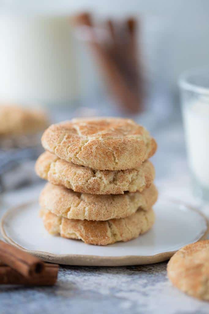 four gluten free snickerdoodle cookies stacked