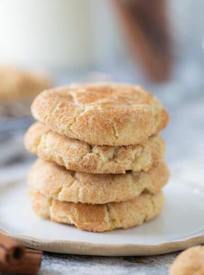 four snickerdoodle cookies stacked