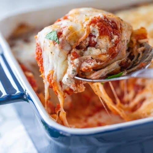 scoop of pasta bake removed from baking dish