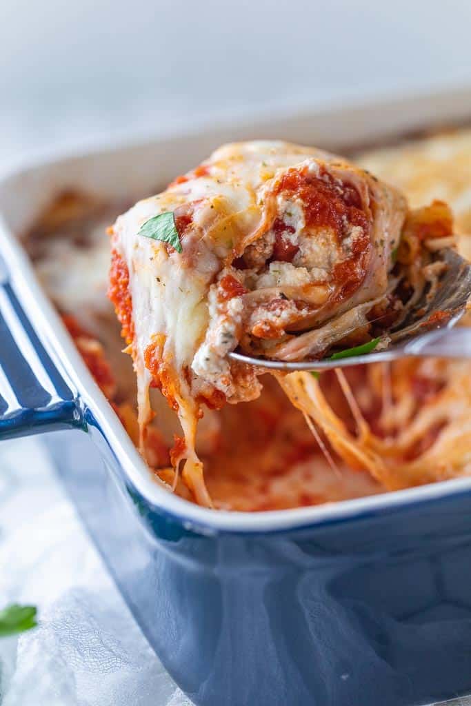 scoop of pasta bake removed from baking dish