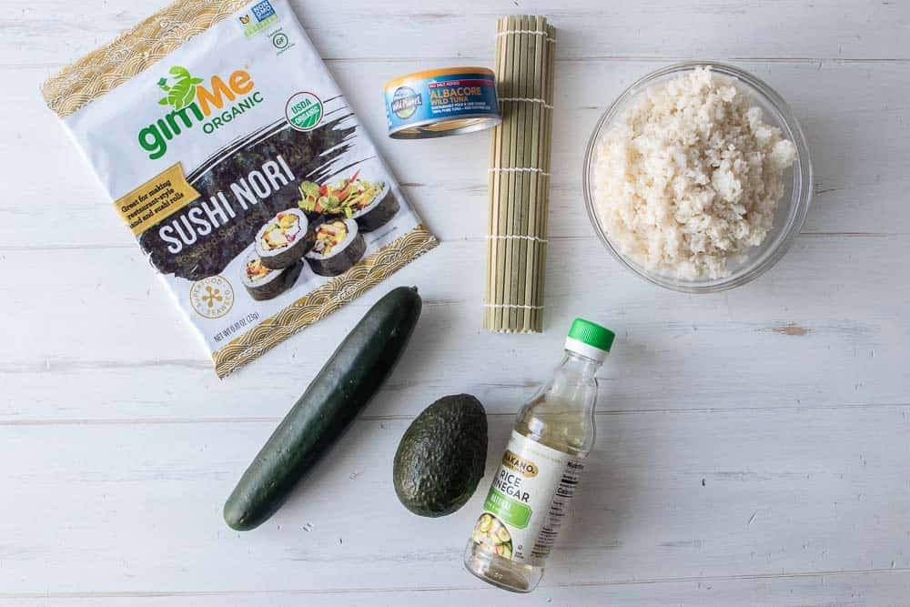 Ingredients to make tuna sushi on a table.