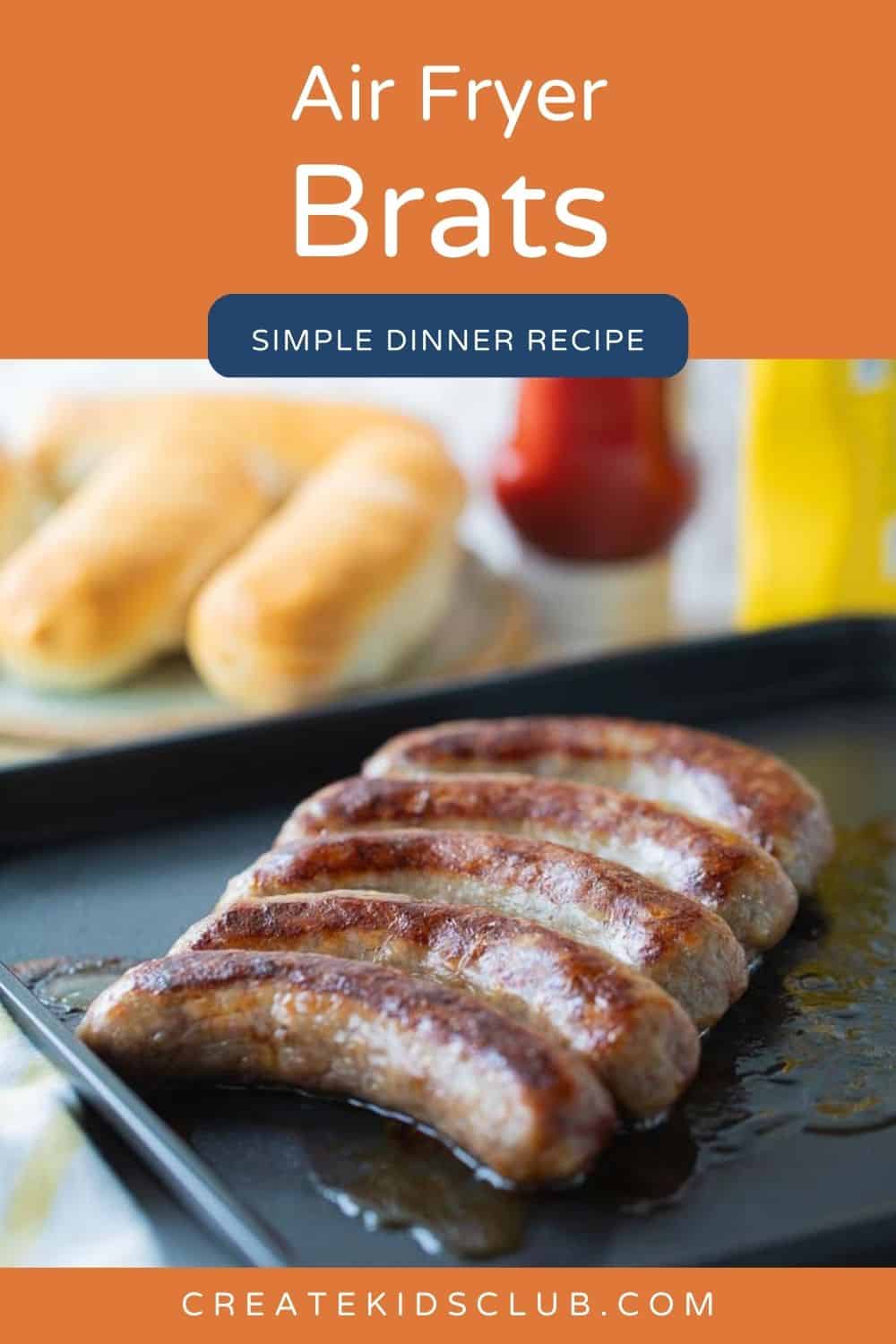 A pin of air fryer brats shown cooked on an air fryer tray.
