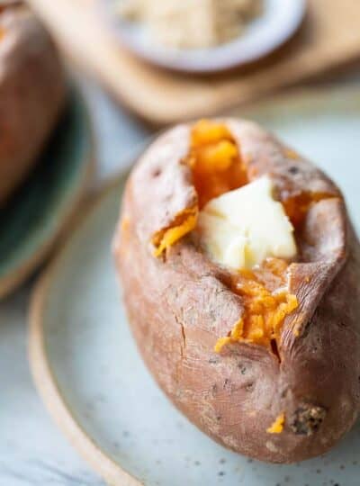 close up of butter melting into cooked sweet potato