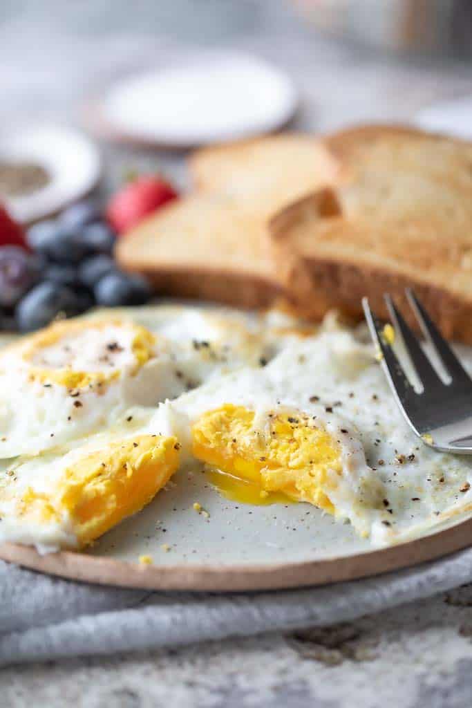 fork on plate with breakfast foods