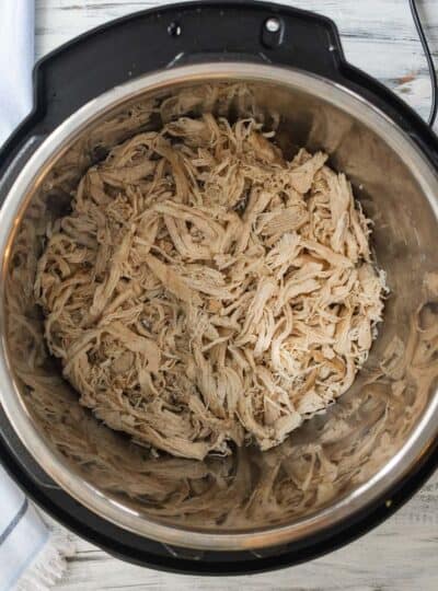 top down view of shredded chicken in instant pot