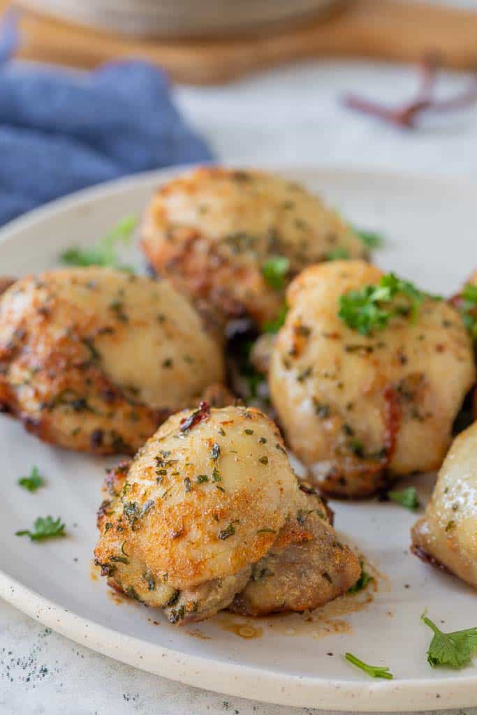 crispy chicken thighs on platter