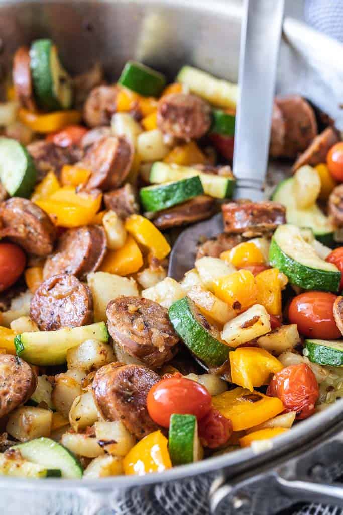 sauteed vegetables, potatoes and sausage in skillet