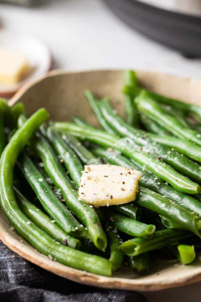 green beans topped with butter