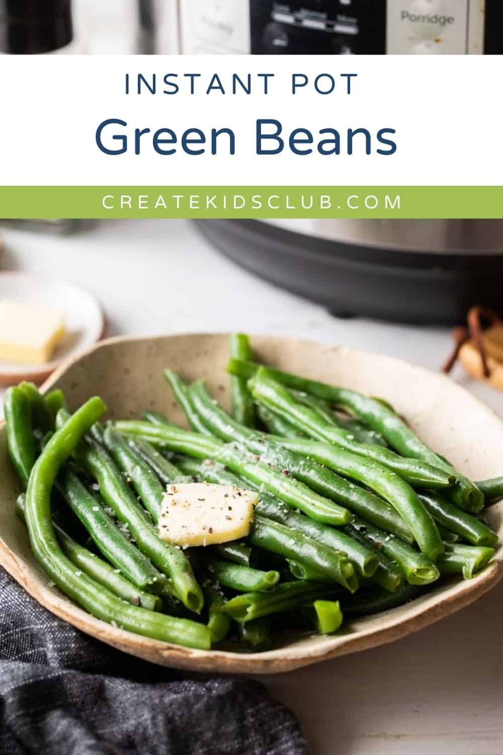 Pin of instant pot green beans shown in a bowl.