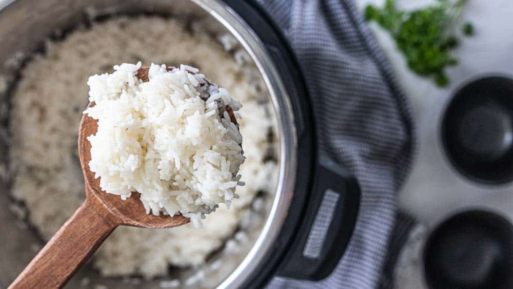 wooden spoon with scoop of rice