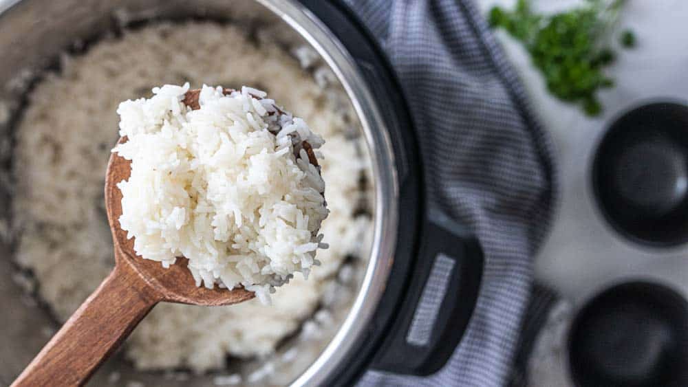 wooden spoon with scoop of rice