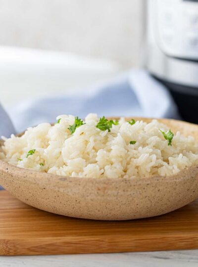 white rice in bowl garnished