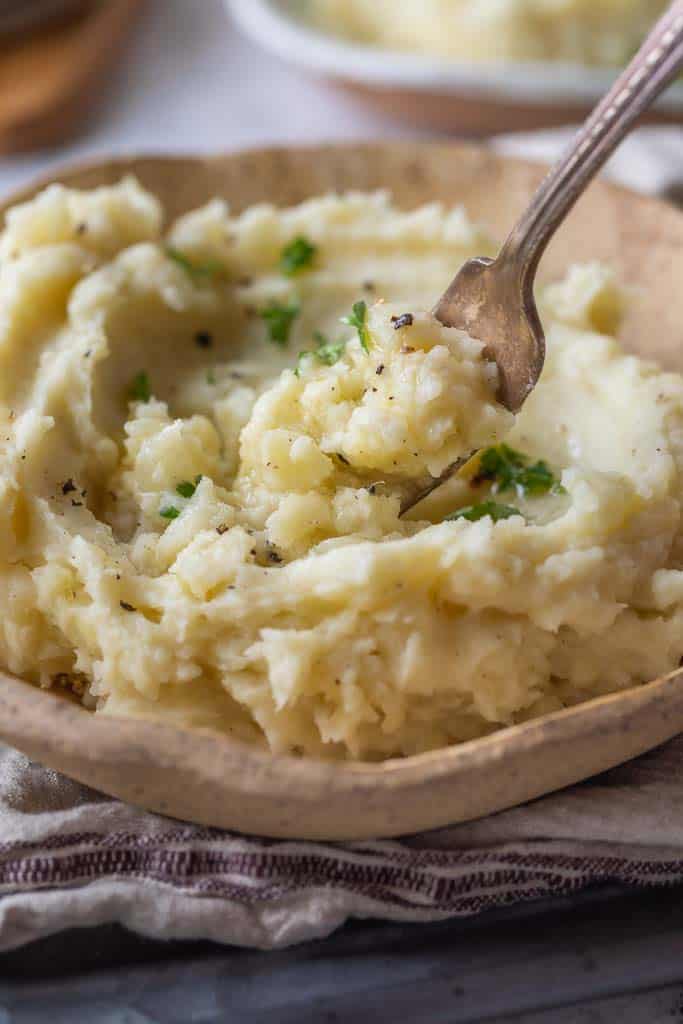 fork scooping into microwave mashed potatoes