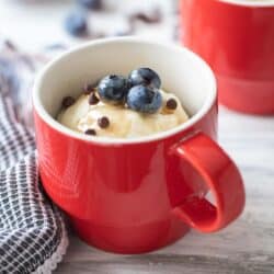 pancake in a mug topped with blueberries