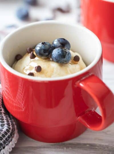 pancake in a mug topped with blueberries