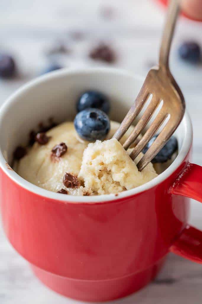 fork scooping into a cup with pancake