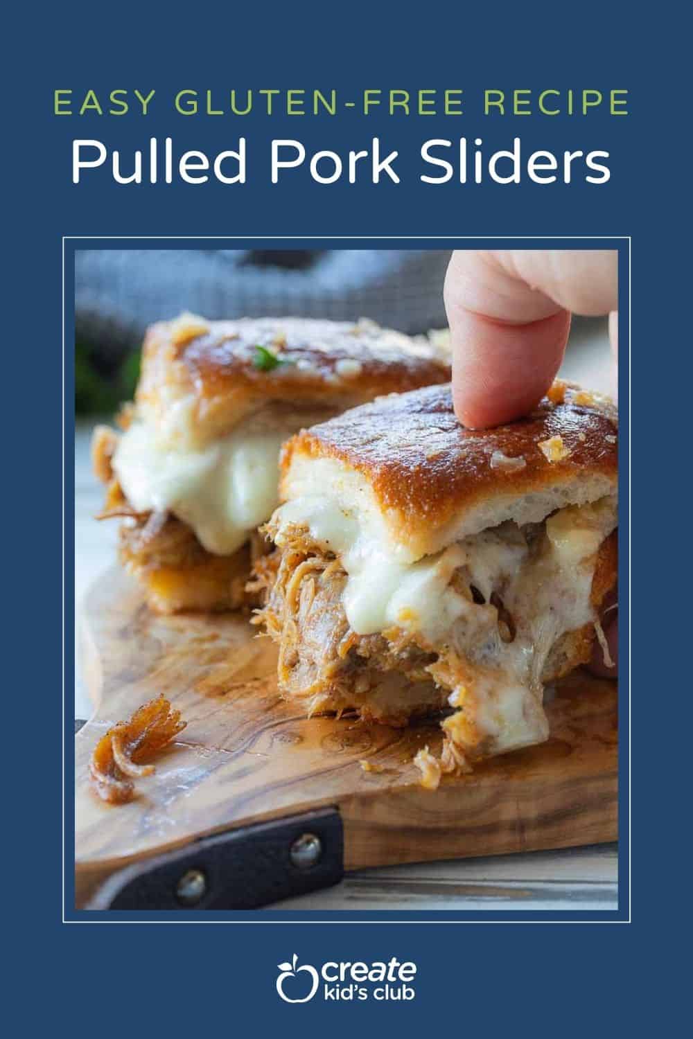 Pin of a pulled pork slider being picked up.