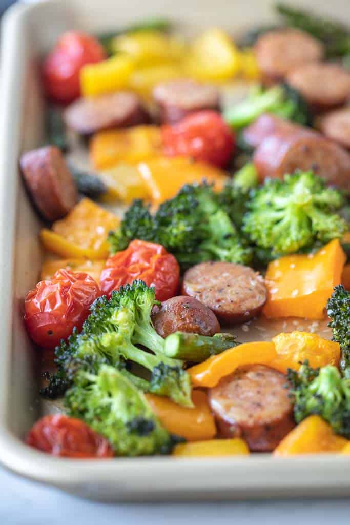 roasted vegetables and sausage on sheet pan