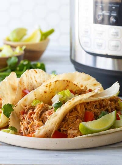 shredded chicken tacos on plate