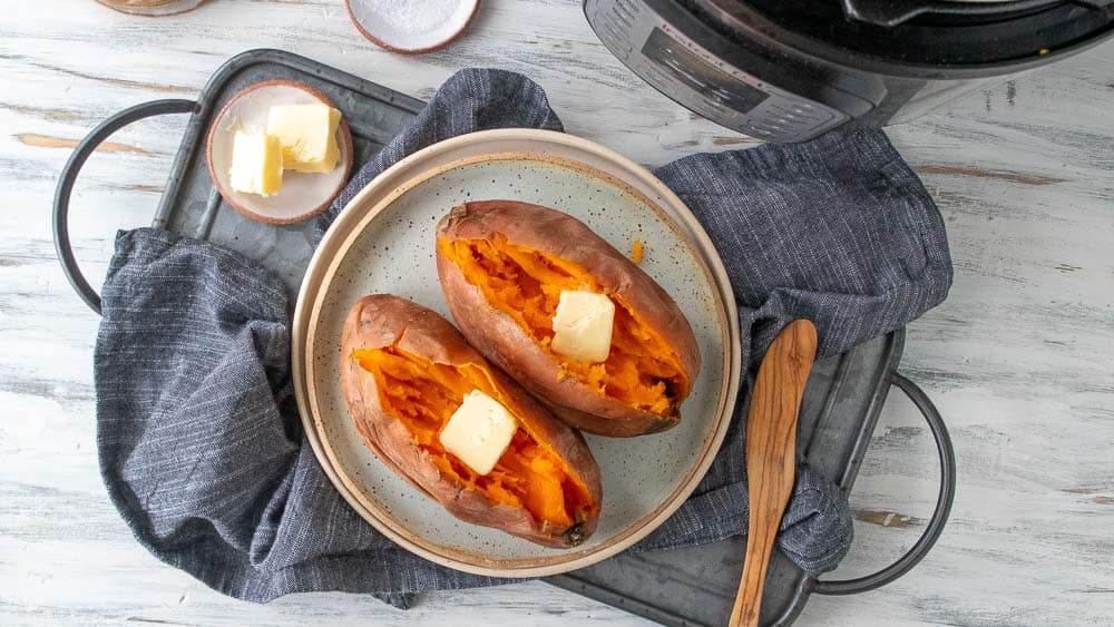 top down view of cooked sweet potatoes with butter