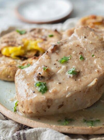 creamy pork chop on a plate