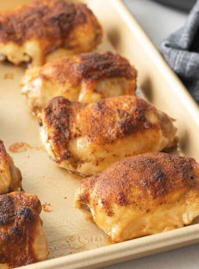 seasoned chicken thighs on sheet pan