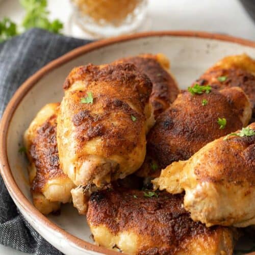 crispy chicken thighs in bowl