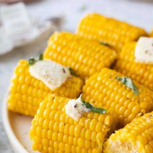 platter of buttery corn cobs