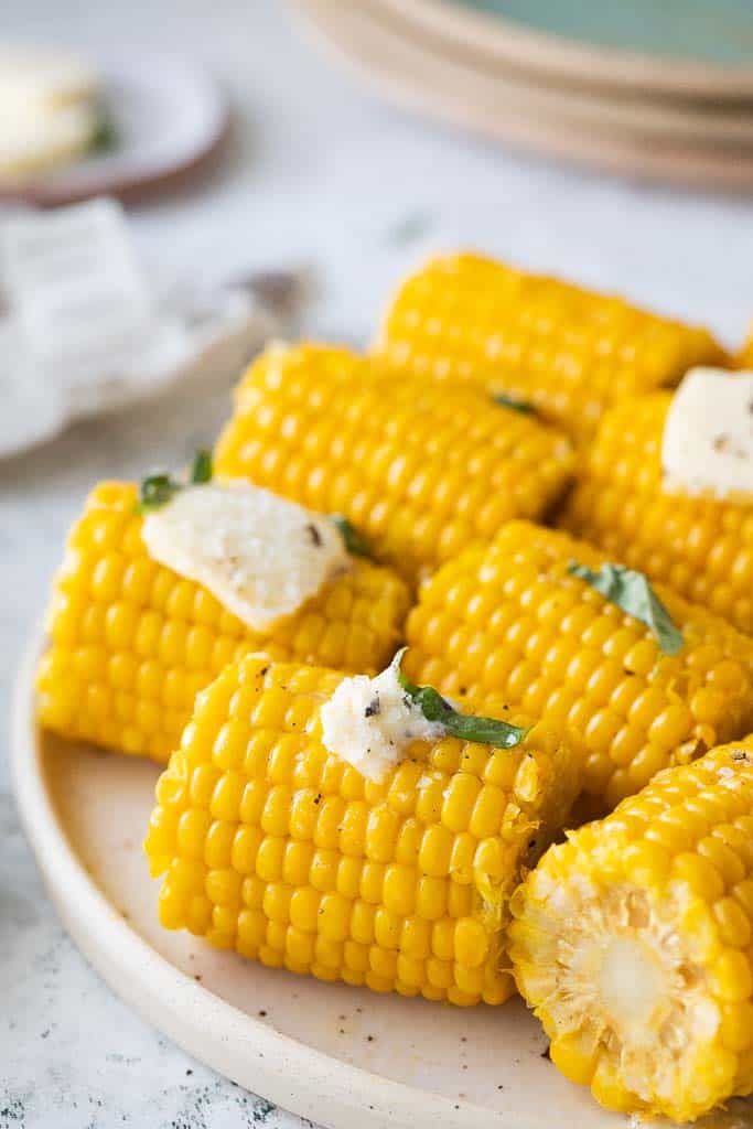 platter of buttery corn cobs