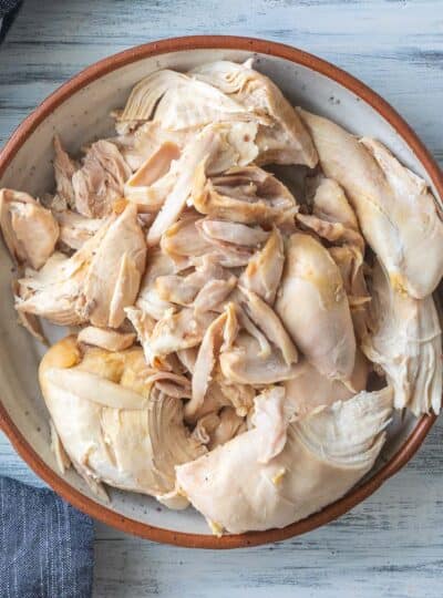 top down shot of boiled chicken in a bowl