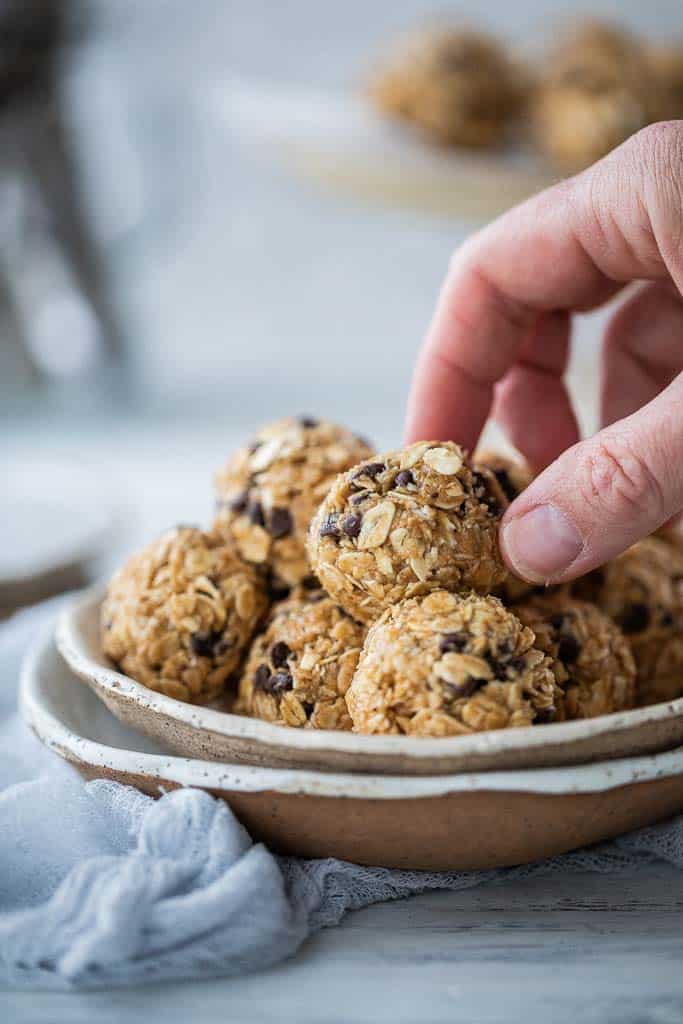 hand picking up peanut butter ball