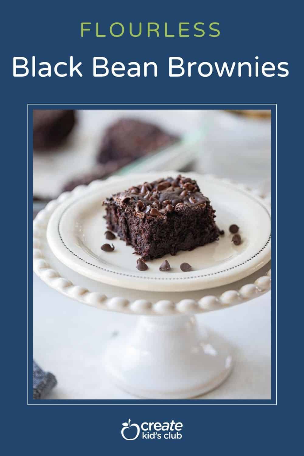 pin image of flourless black bean brownie square on cake stand