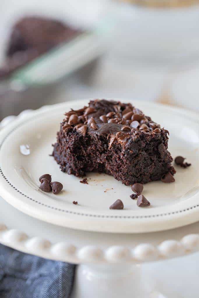 black bean brownie with missing bite on a plate