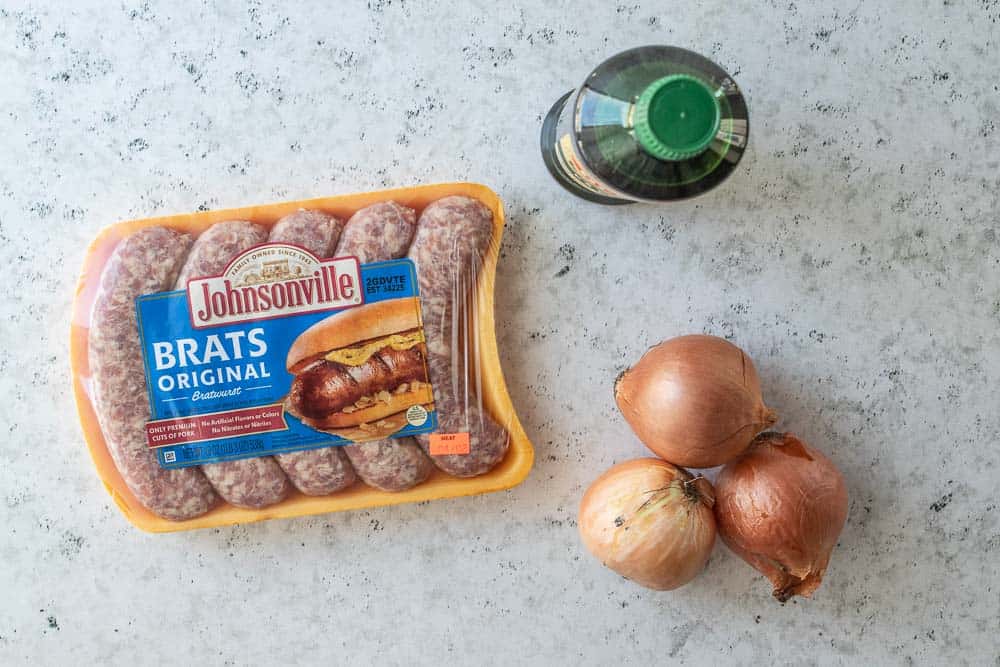 package of brats, olive oil and three onions displayed
