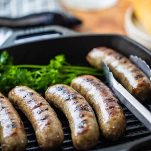 side view of brats with grill marks