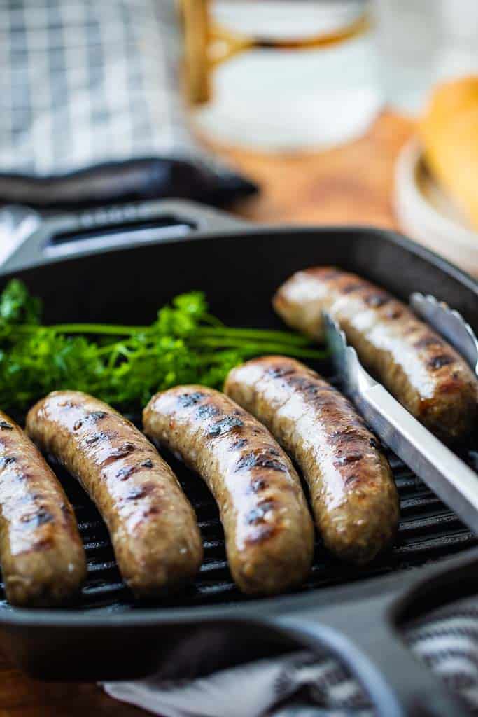 side view of brats with grill marks