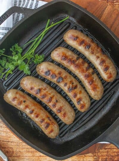 top down view of brats in a grill pan