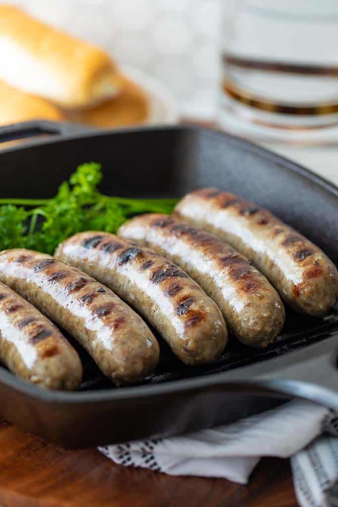 five brats in a grill pan