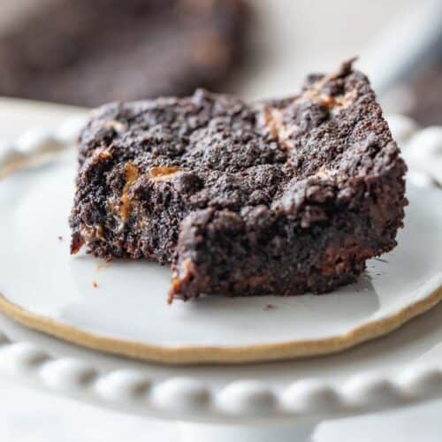 close up view of chocolate caramel bar on cake stand