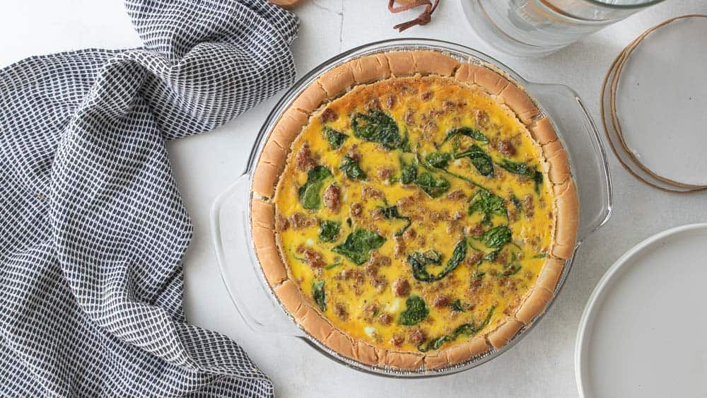 top down shot of dairy free quiche with crust in pie plate