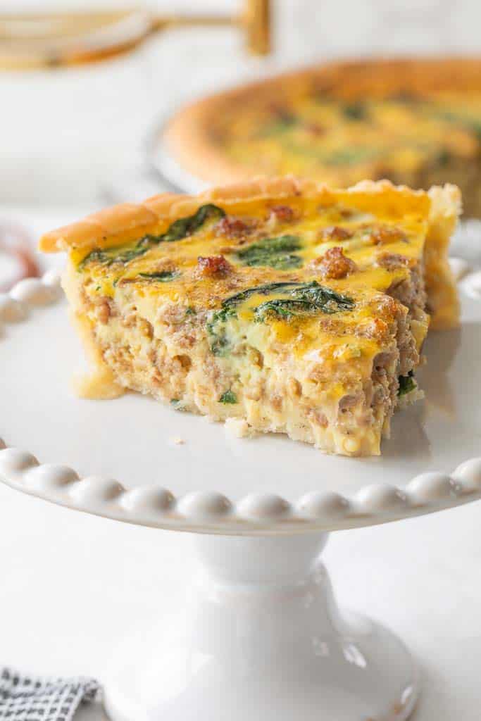 slice of dairy free quiche on a stand