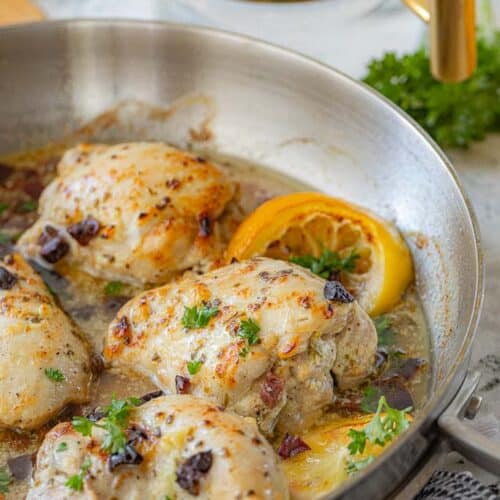 seasoned chicken thighs in skillet