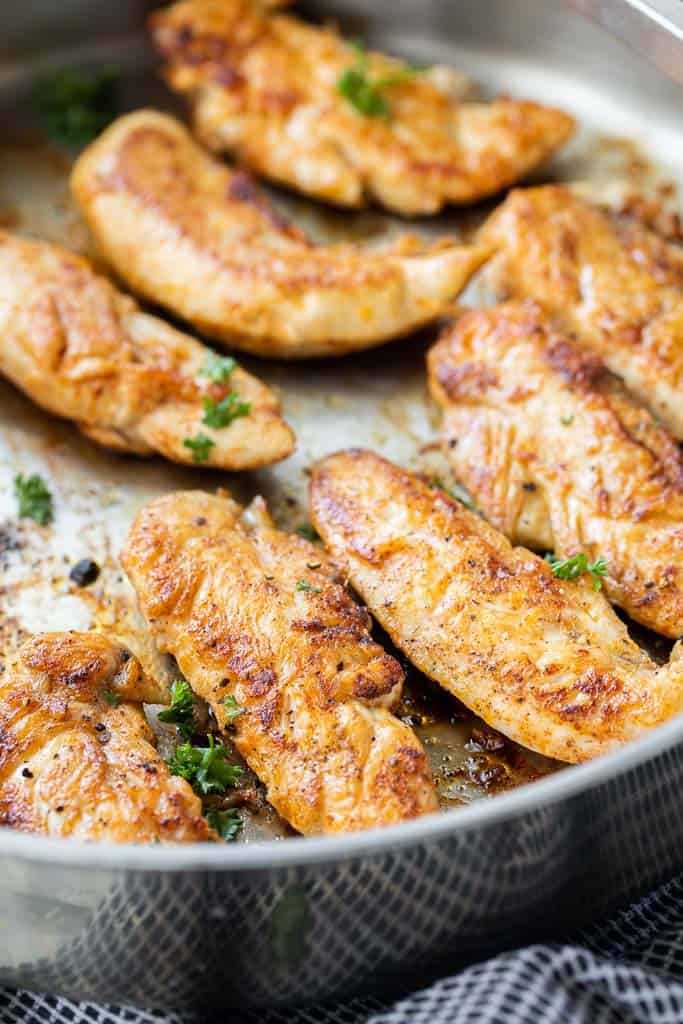 seasoned chicken tenders in pan